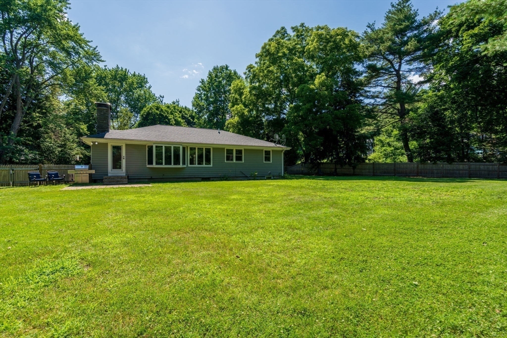335 Conant Road Weston, MA 02493 - Photo 28 of 31 a view of a house with a big yard