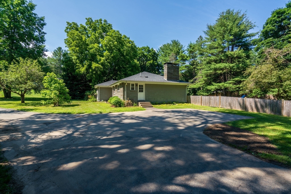 335 Conant Road Weston, MA 02493 - Photo 30 of 31 a view of yard with swimming pool and small yard