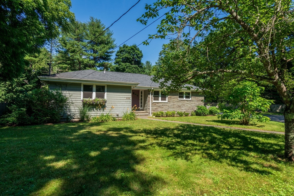 335 Conant Road Weston, MA 02493 - Photo 31 of 31 a front view of a house with a yard