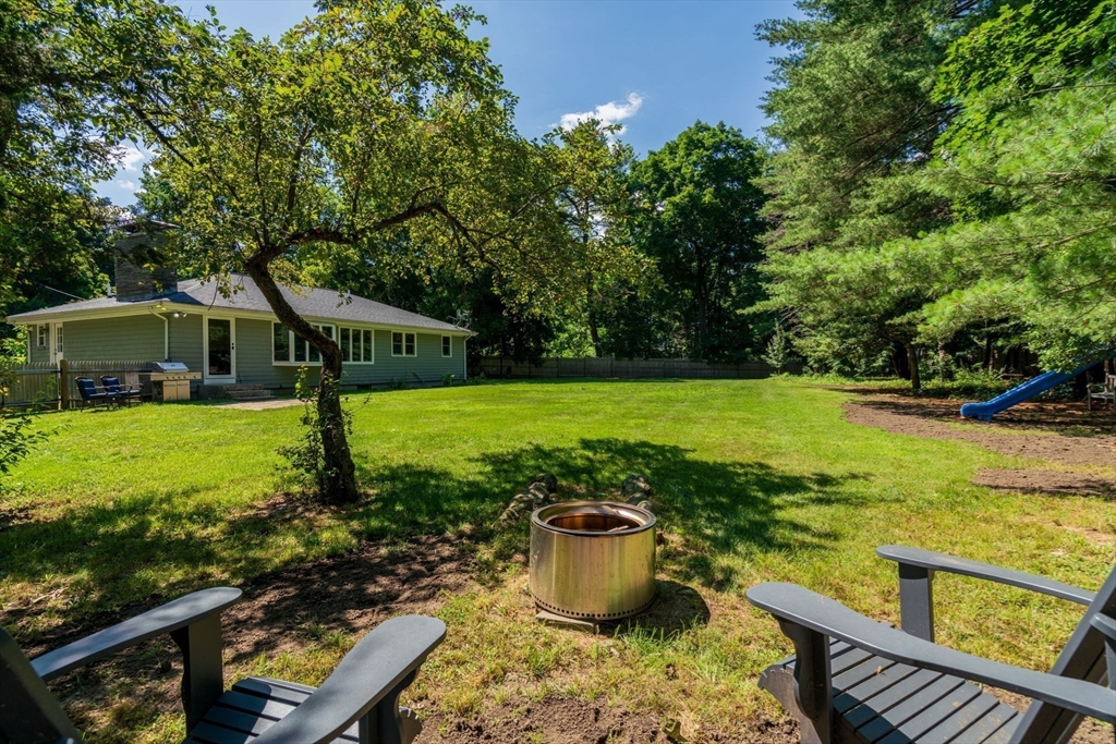 335 Conant Road Weston, MA 02493 - Photo 4 of 31 a view of a swimming pool with a patio