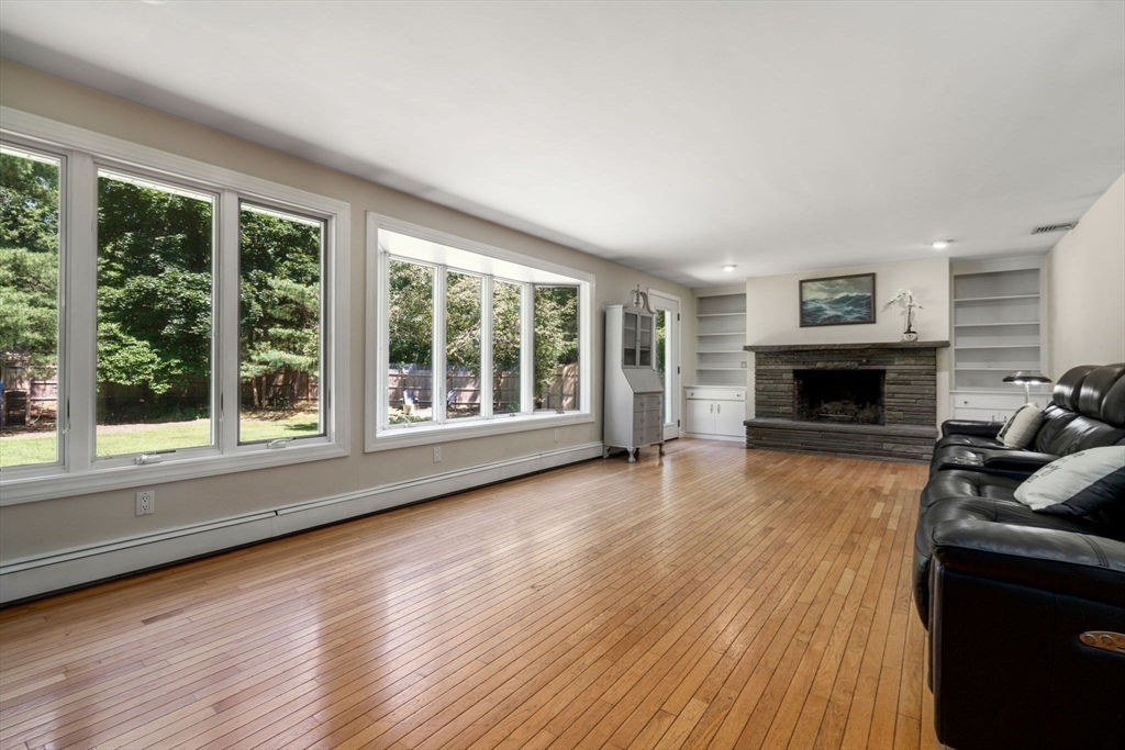 335 Conant Road Weston, MA 02493 - Photo 9 of 31 a living room with furniture and a fireplace