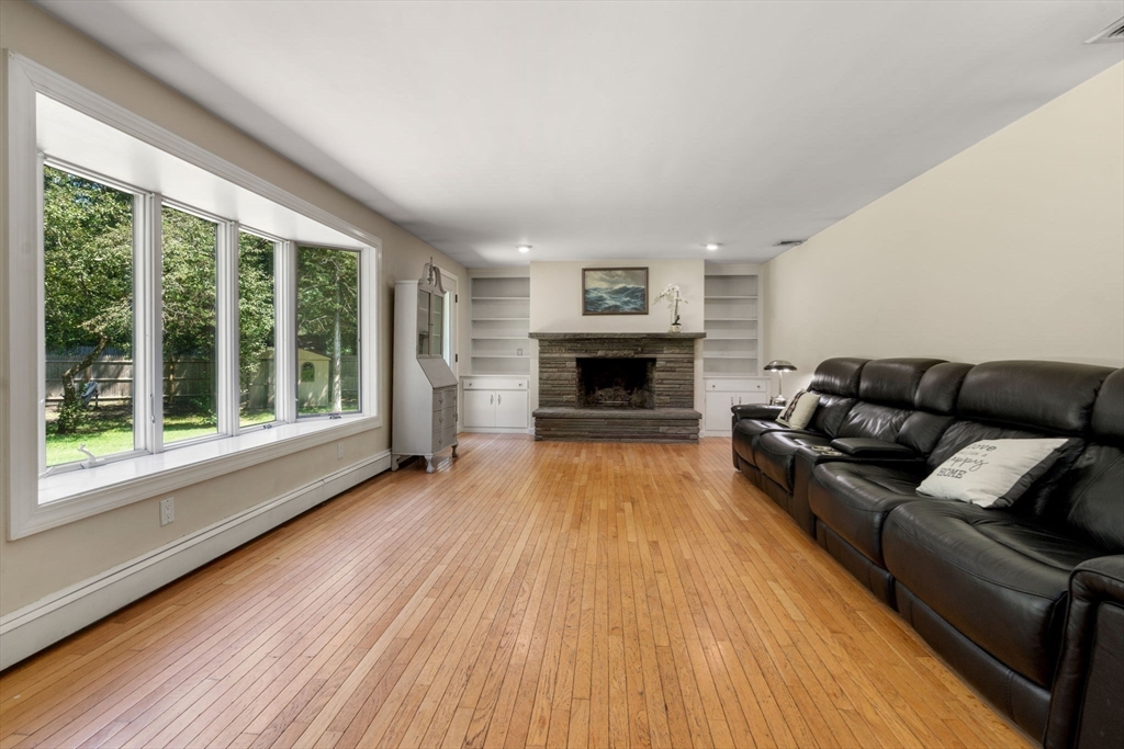 335 Conant Road Weston, MA 02493 - Photo 10 of 31 a living room with furniture and a fireplace