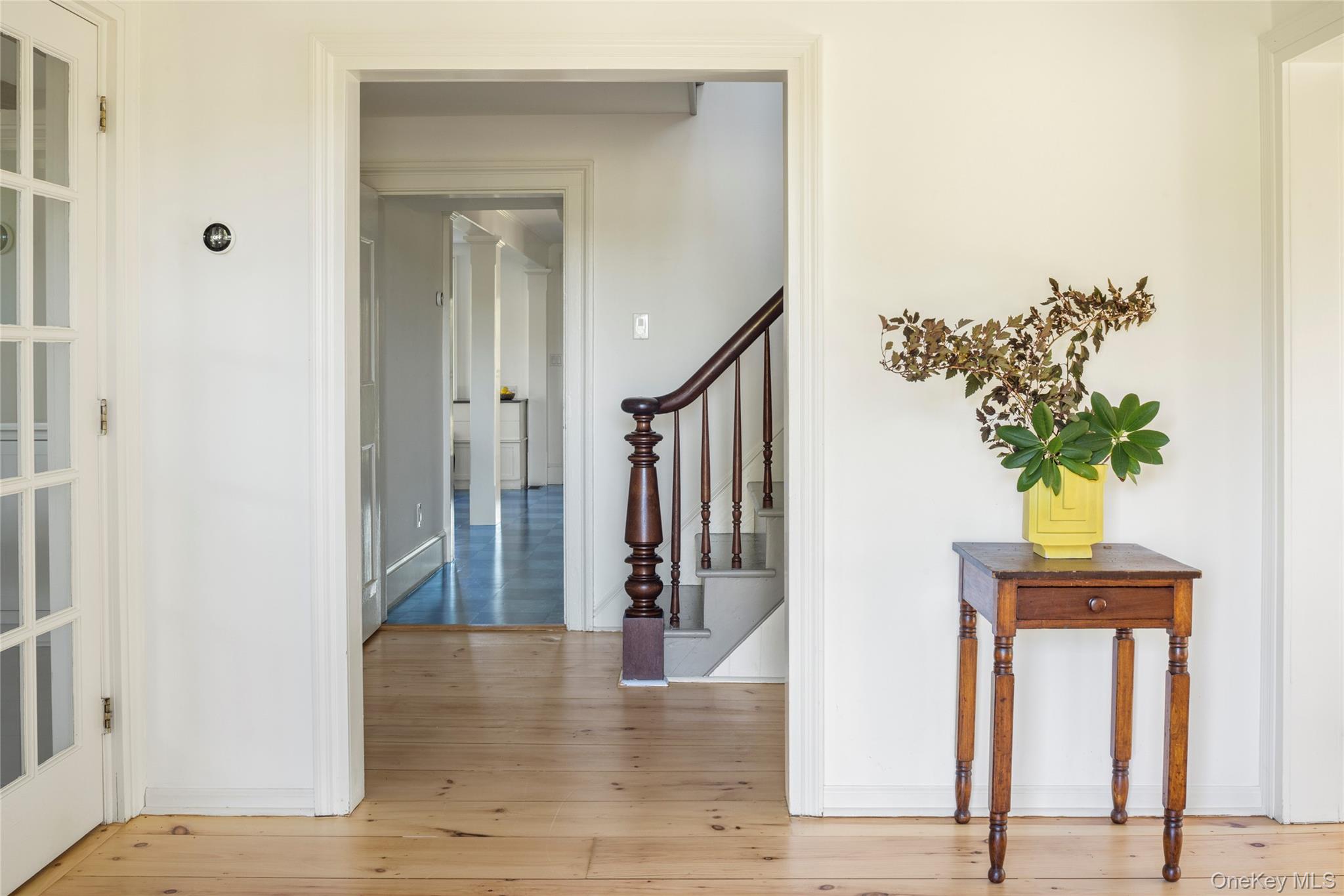 108 Wey Road Rhinebeck, NY 12572 - Photo 3 of 24 a view of staircase with wooden floor and a potted plant
