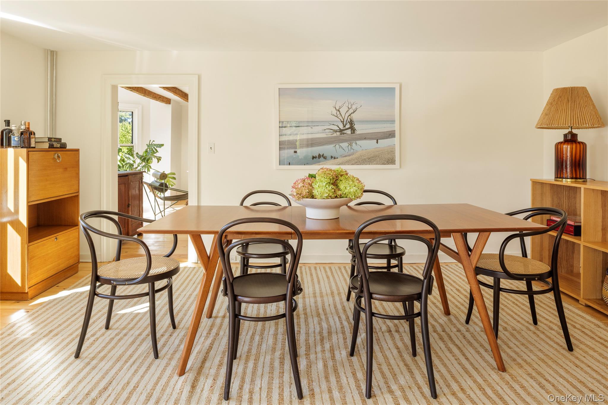 108 Wey Road Rhinebeck, NY 12572 - Photo 7 of 24 a view of a dining room with furniture and wooden floor