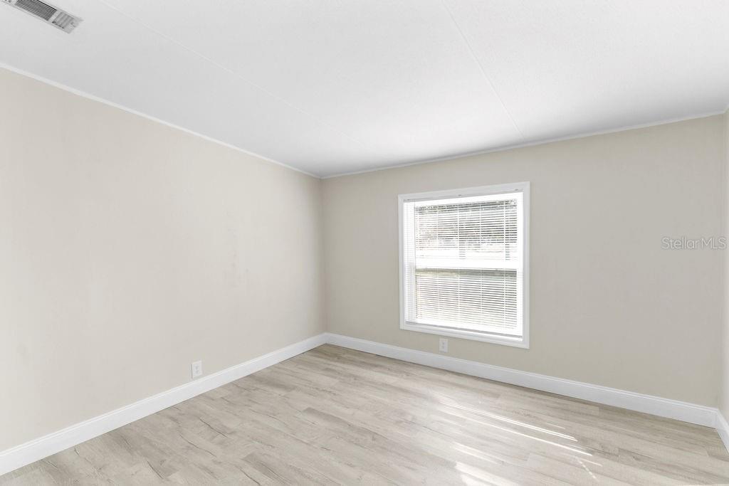 18137 Hollister Road Orlando, FL 32820 - Photo 15 of 27 an empty room with a window