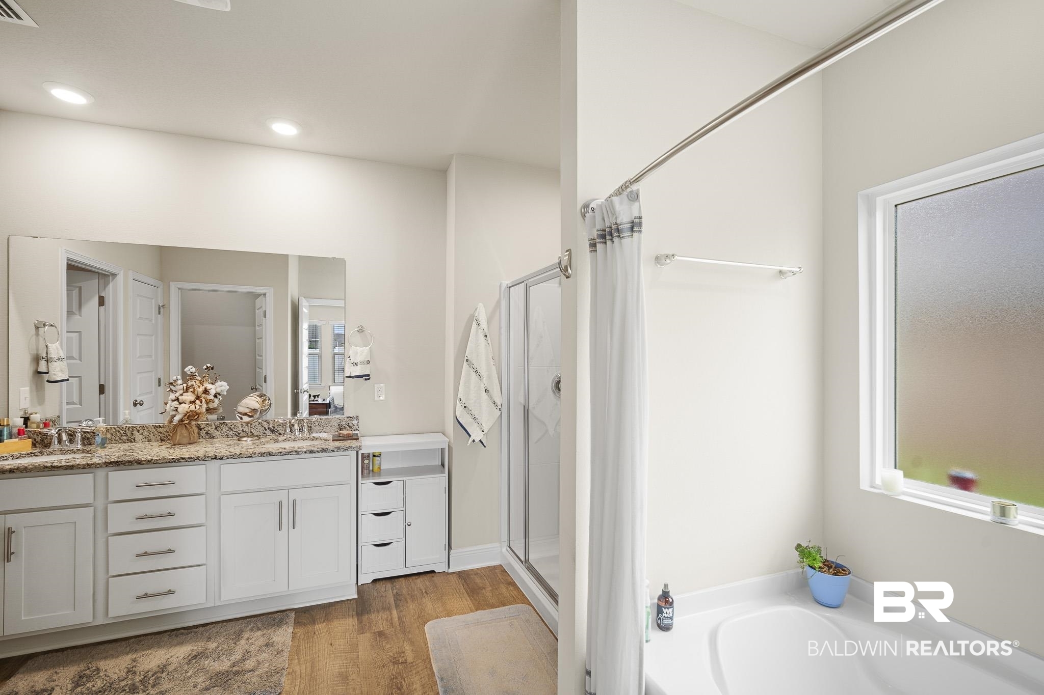 24765 Spectacular Bid Loop Daphne, AL 36526 - Photo 37 of 45 Bathroom with hardwood / wood-style flooring, plus walk in shower, and vanity