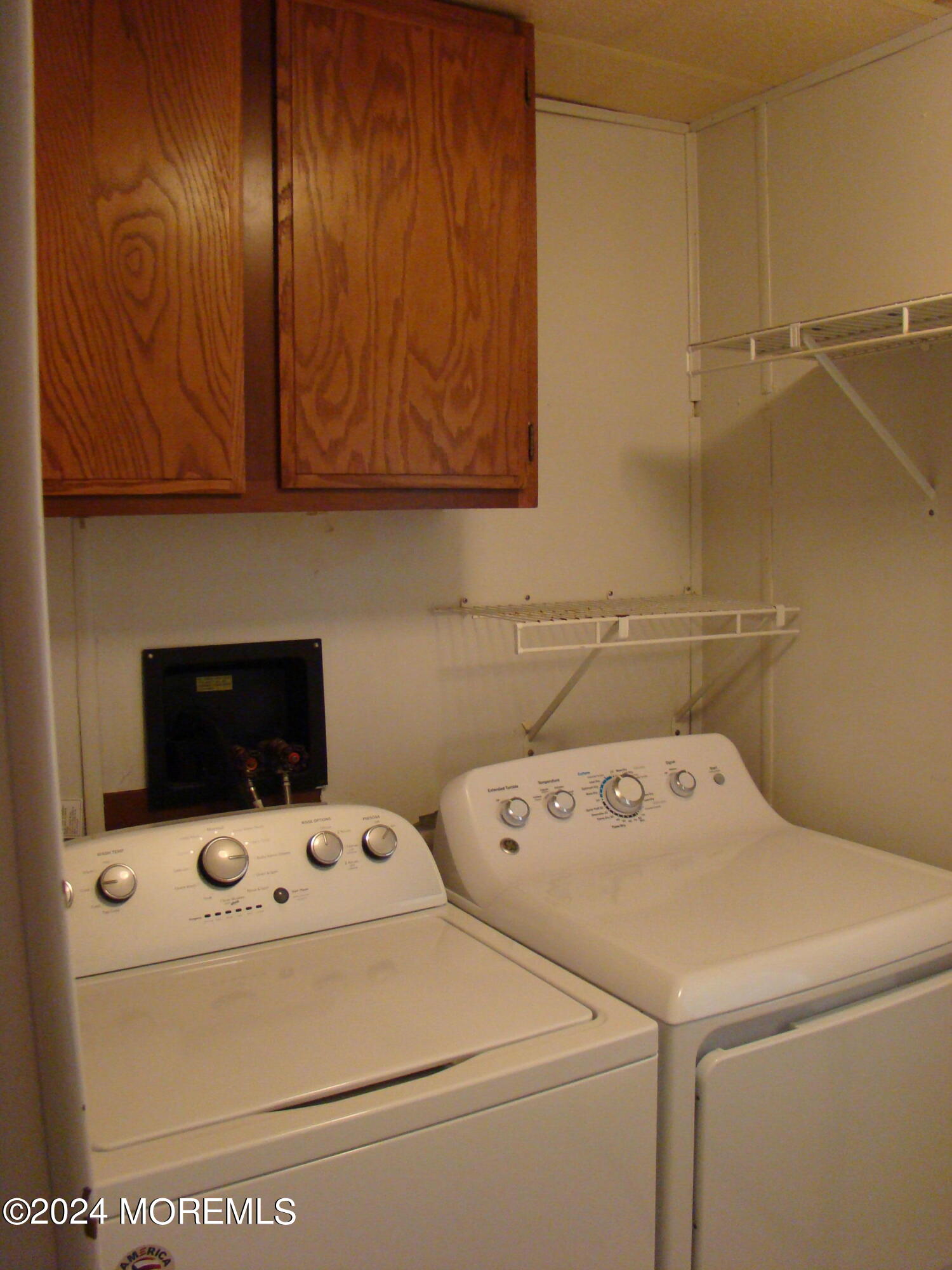 504 Rosalind Road Freehold, NJ 07728 - Photo 4 of 8 a utility room with dryer and washer