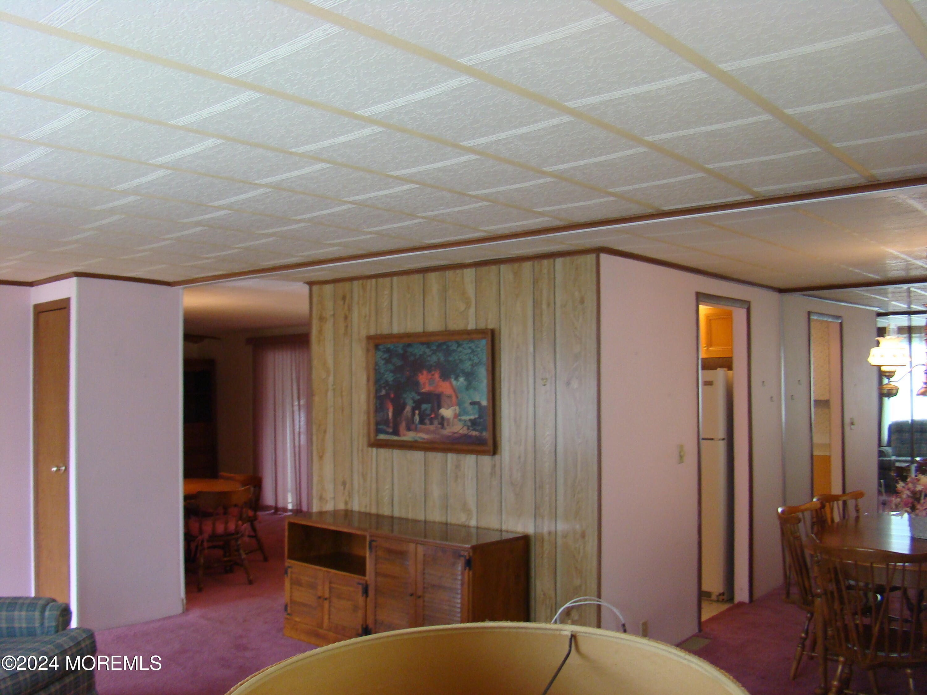 504 Rosalind Road Freehold, NJ 07728 - Photo 5 of 8 a living room with furniture a desk and chair with wooden floor