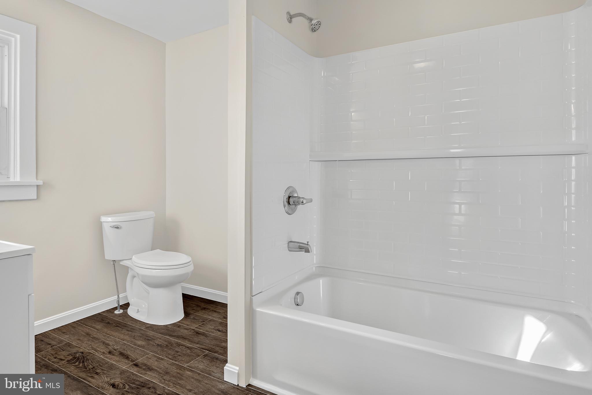 206 Hershey Road Hummelstown, PA 17036 - Photo 19 of 26 a bathroom with a toilet and a bathtub