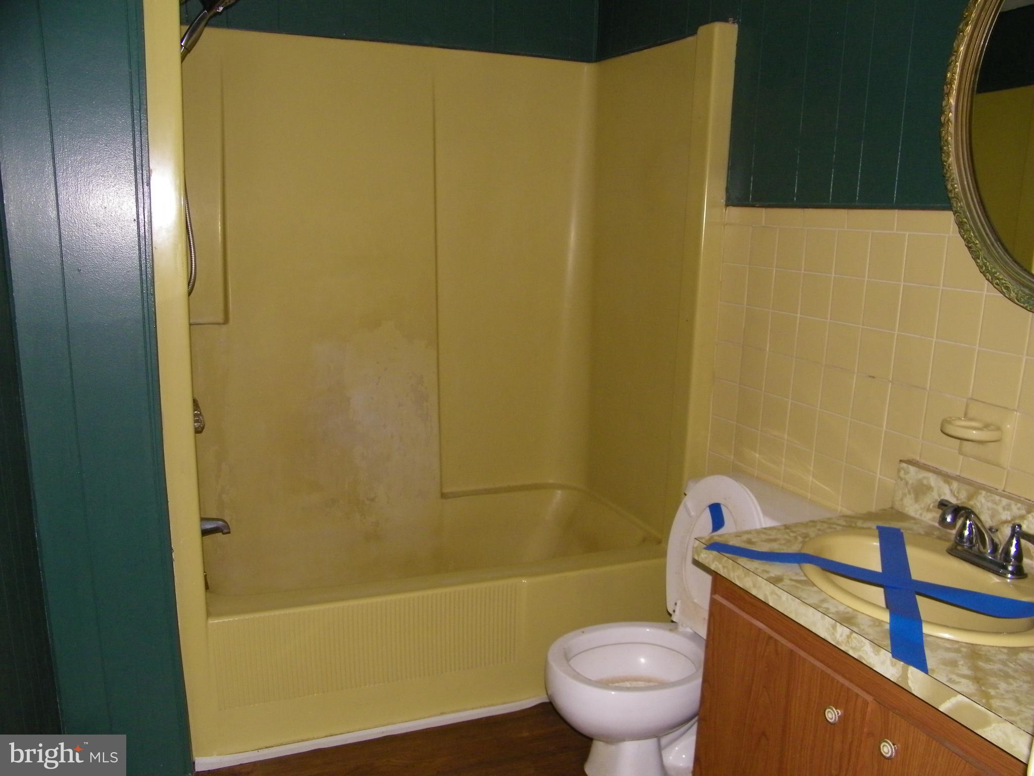 617 Frederick Street Cumberland, MD 21502 - Photo 14 of 16 a bathroom with a sink and a tub