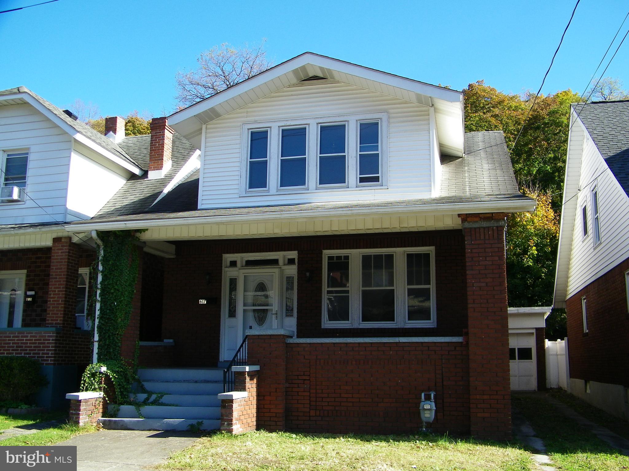 617 Frederick Street Cumberland, MD 21502 - Photo 2 of 16 a view of brick house with large windows