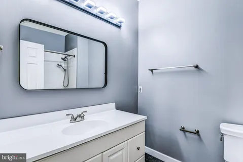 a bathroom with a sink and mirror