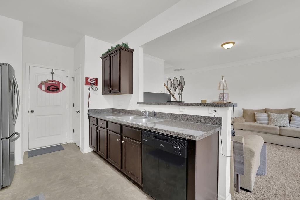 288 Valley Crossing Canton, GA 30114 - Photo 11 of 22 a bathroom with a granite countertop sink a mirror and shower