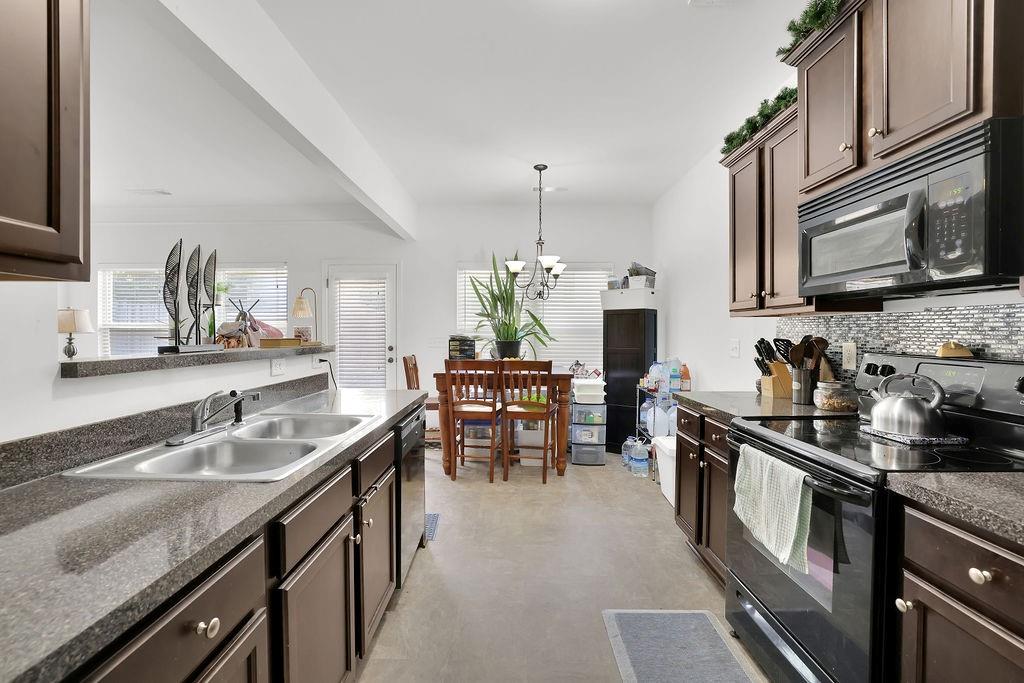 288 Valley Crossing Canton, GA 30114 - Photo 13 of 22 a kitchen with lots of counter top space and appliances