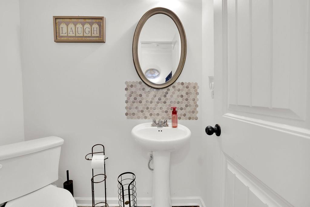 288 Valley Crossing Canton, GA 30114 - Photo 14 of 22 a bathroom with a sink and a mirror