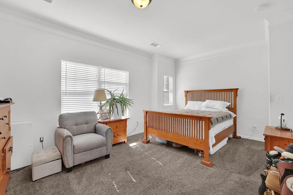 288 Valley Crossing Canton, GA 30114 - Photo 15 of 22 a bedroom with a bed and a couch