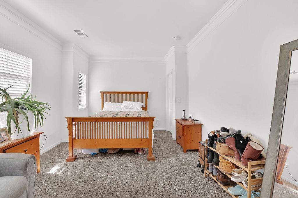 288 Valley Crossing Canton, GA 30114 - Photo 16 of 22 a room with furniture and a dining table with chairs