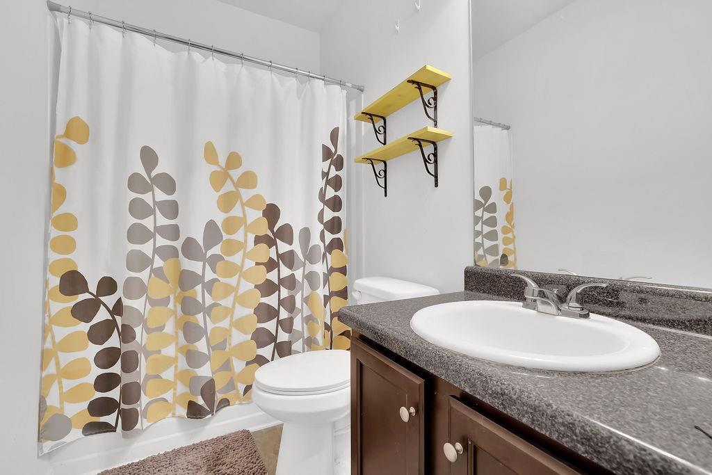 288 Valley Crossing Canton, GA 30114 - Photo 21 of 22 a bathroom with a granite countertop sink and a mirror