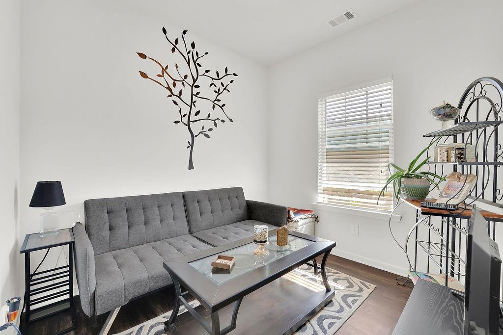 288 Valley Crossing Canton, GA 30114 - Photo 4 of 22 a living room with furniture and wooden floor