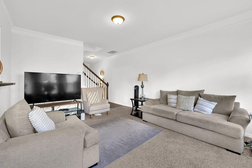 288 Valley Crossing Canton, GA 30114 - Photo 8 of 22 a living room with furniture and a flat screen tv