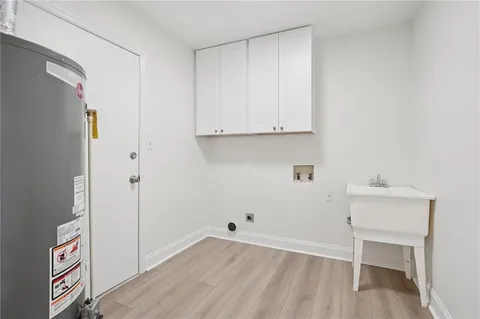 a bathroom with a sink a shower and a mirror