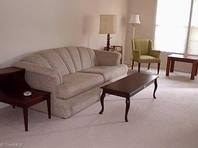 4839 Tower Road, Unit B Greensboro, NC 27410 - Photo 2 of 9 Other. Bright and airy Living room with new carpet and paint.