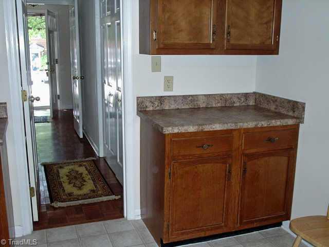 4839 Tower Road, Unit B Greensboro, NC 27410 - Photo 8 of 9 Other. Center hall with laundry area and 1/2 bath. Parque flooring