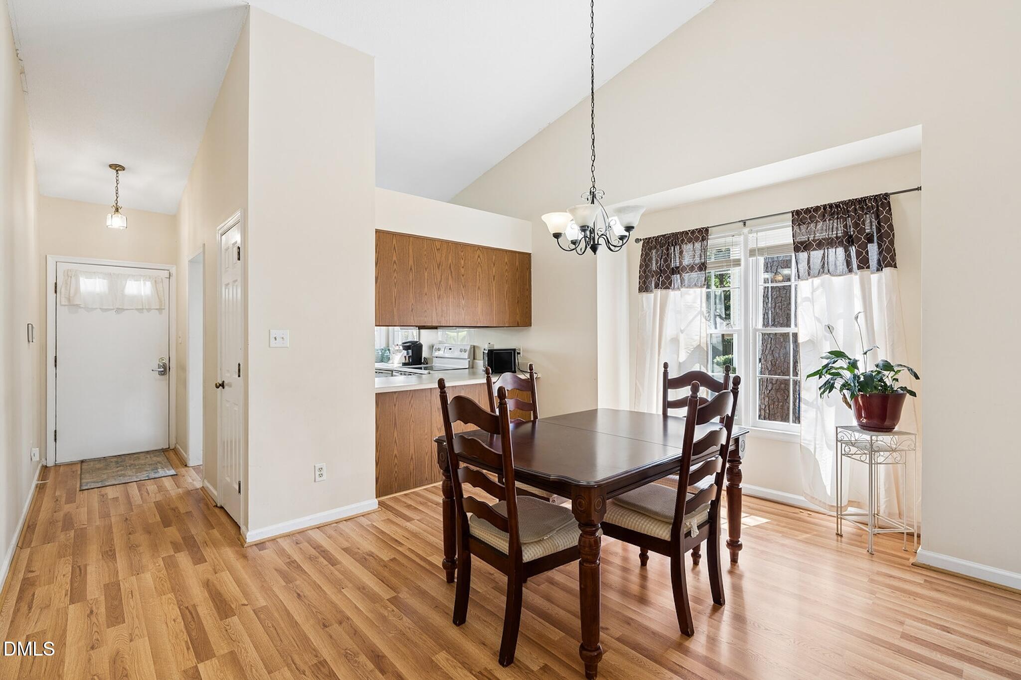 4365 Bona Court Raleigh, NC 27604 - Photo 10 of 29 a view of a dining room with furniture and wooden floor