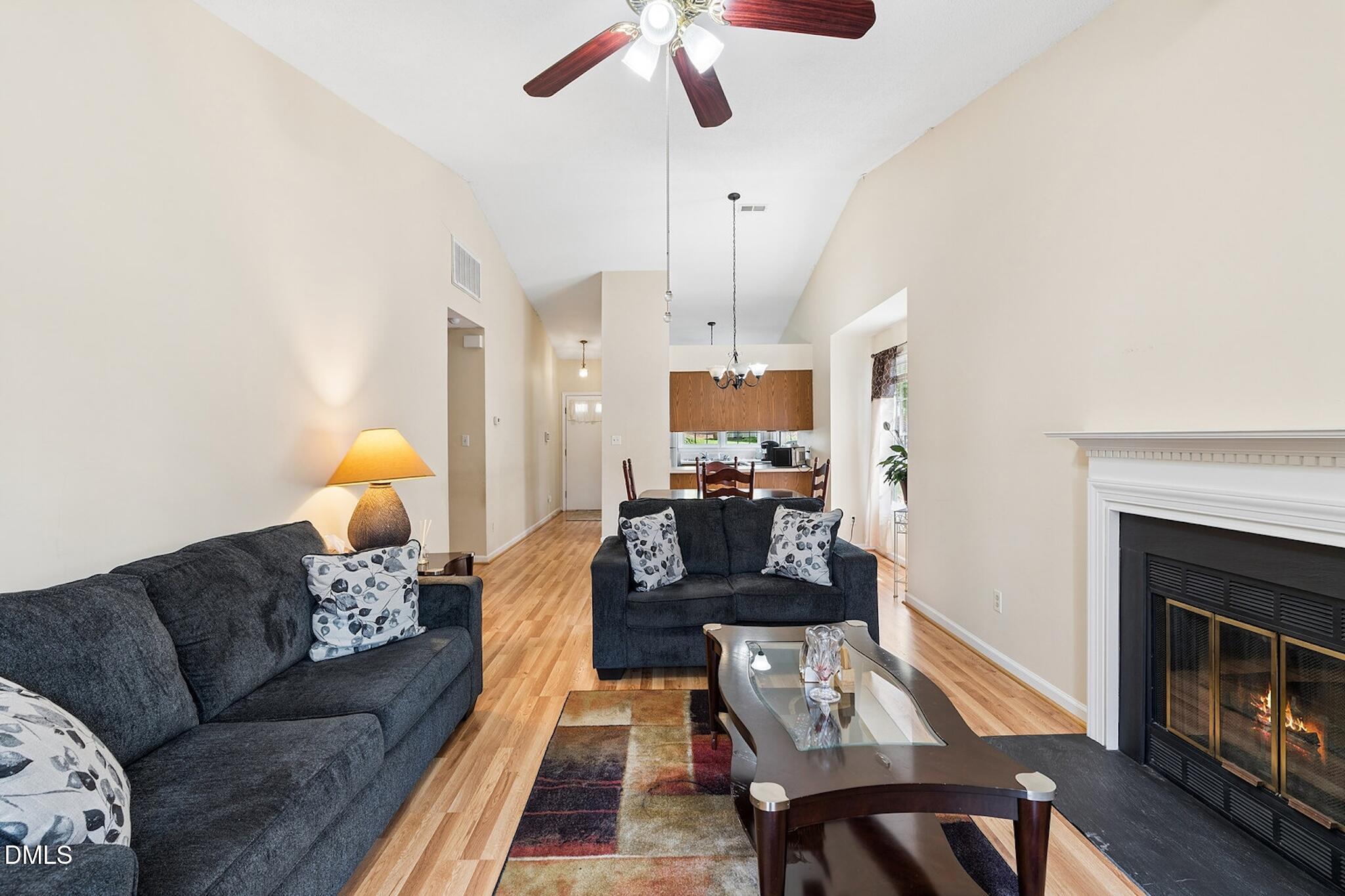4365 Bona Court Raleigh, NC 27604 - Photo 12 of 29 a living room with furniture and a fireplace