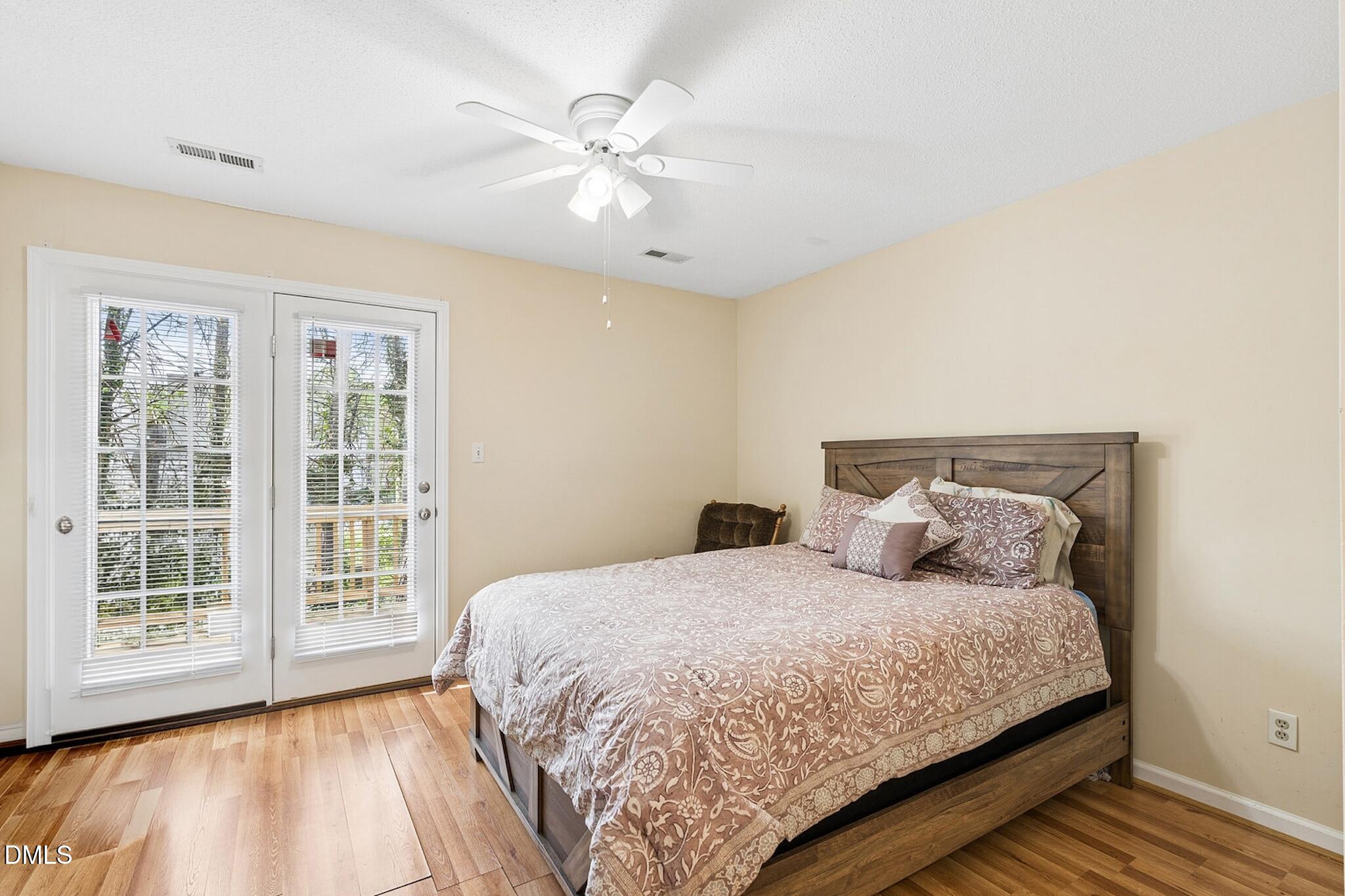 4365 Bona Court Raleigh, NC 27604 - Photo 16 of 29 a bed sitting in a spacious bedroom next to a window