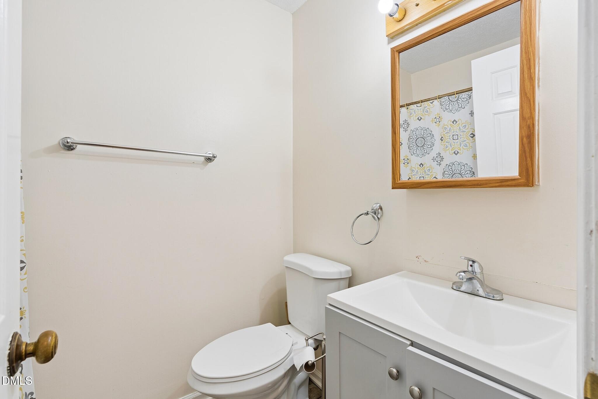4365 Bona Court Raleigh, NC 27604 - Photo 18 of 29 a bathroom with a sink and a toilet