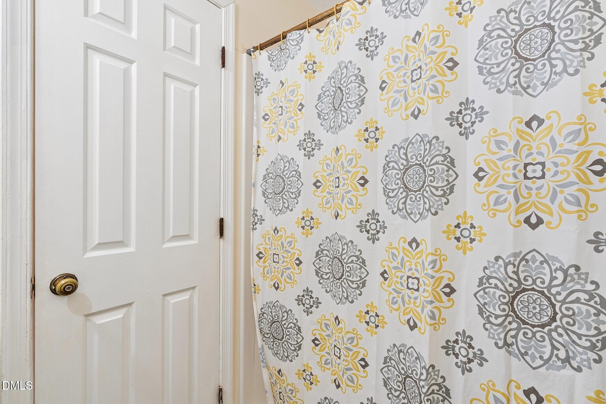 4365 Bona Court Raleigh, NC 27604 - Photo 19 of 29 a bathroom with a shower curtain