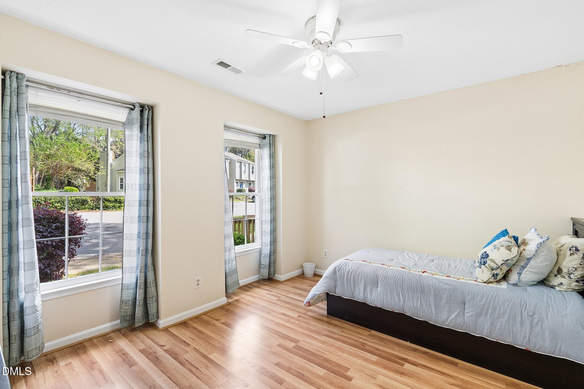 4365 Bona Court Raleigh, NC 27604 - Photo 21 of 29 a bedroom with a bed and a window