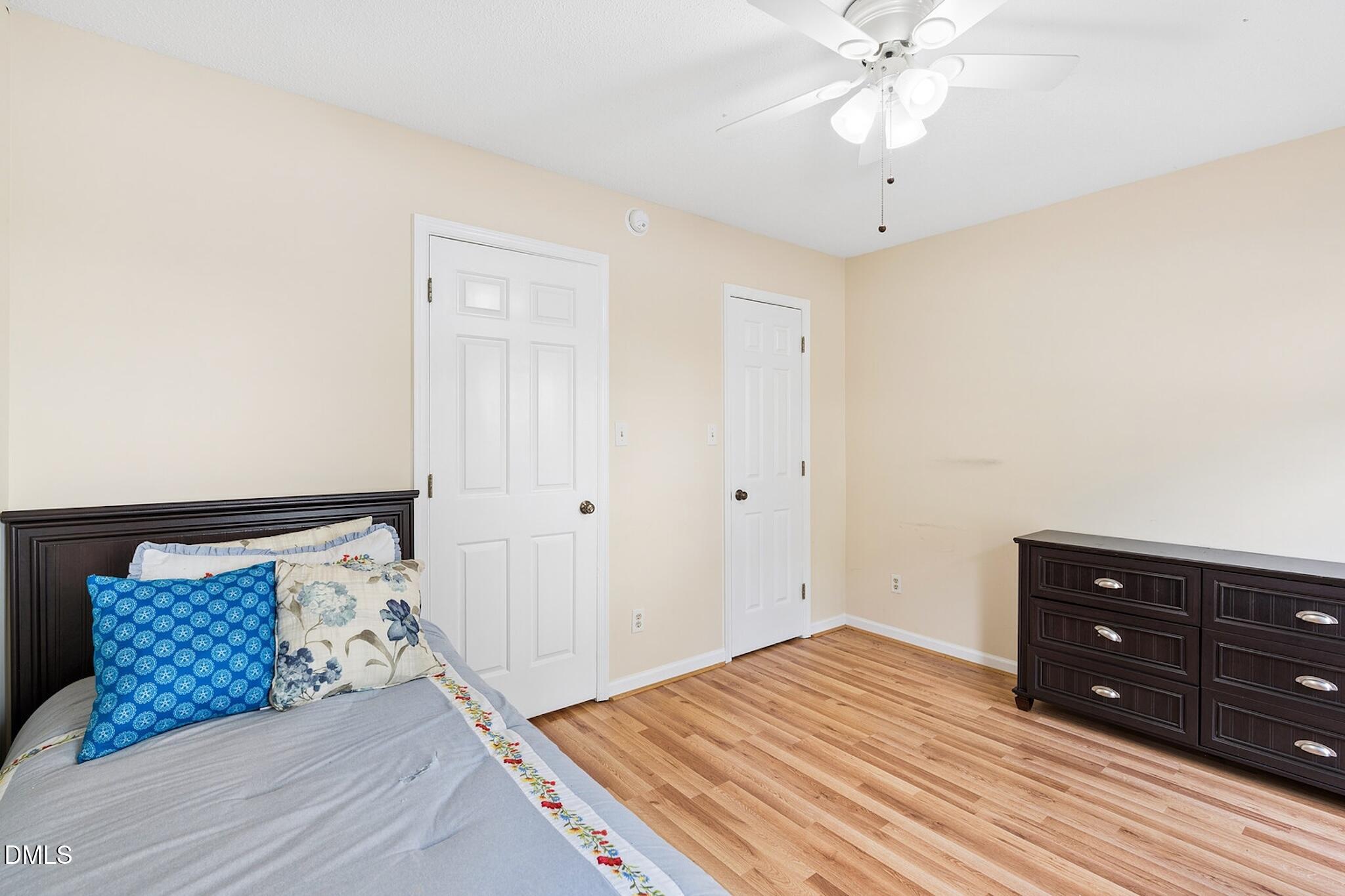 4365 Bona Court Raleigh, NC 27604 - Photo 22 of 29 a bedroom with a bed and a dresser