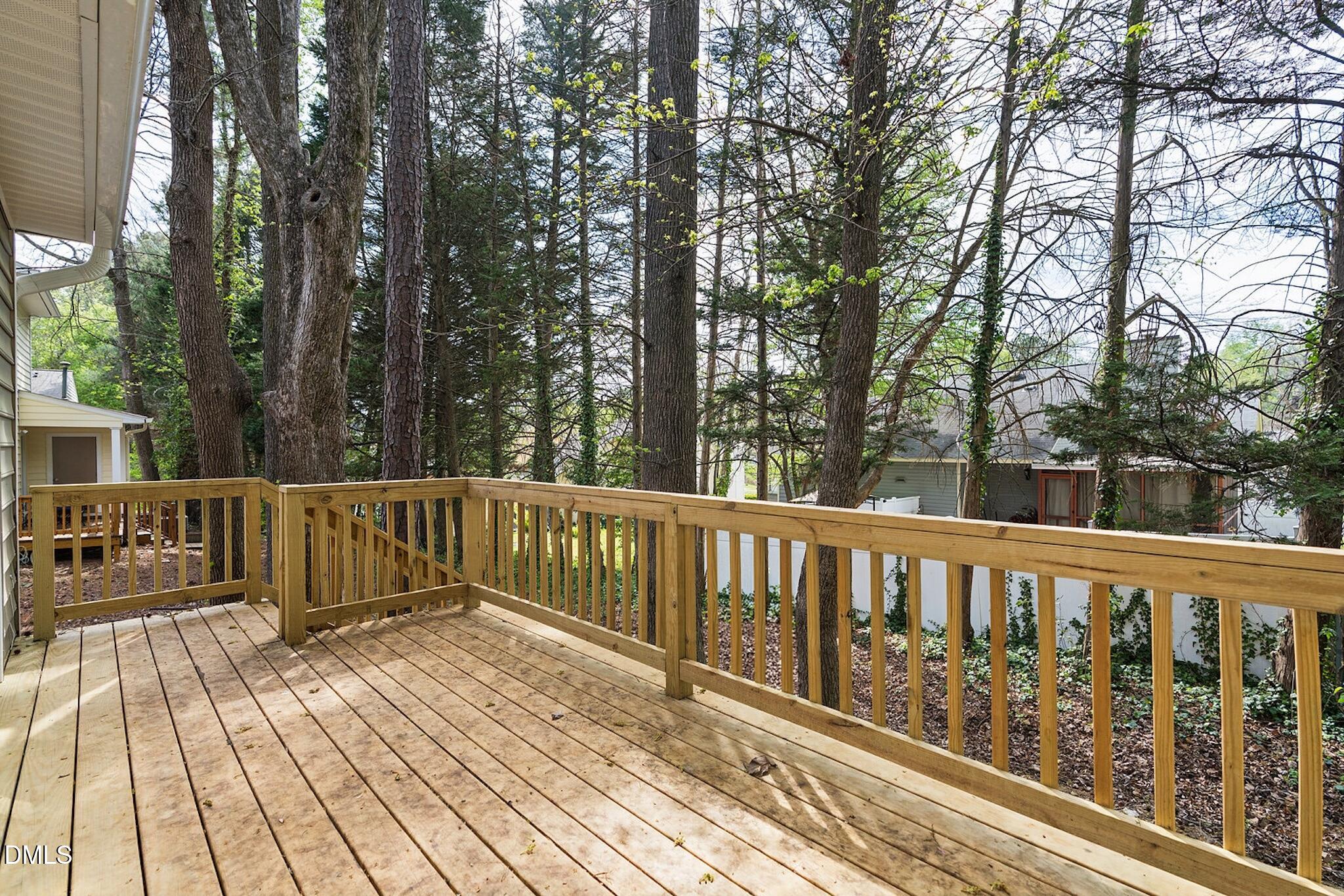 4365 Bona Court Raleigh, NC 27604 - Photo 24 of 29 a view of balcony with wooden floor and fence