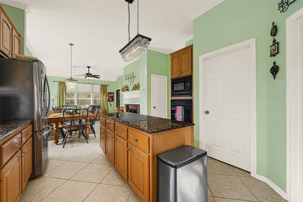 a bathroom with a tub a sink and a mirror