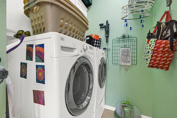 a view of walk in closet with clothes