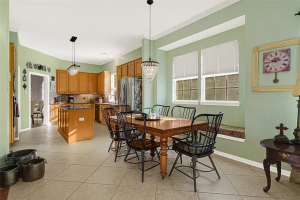 a bathroom with a tub a sink and a mirror