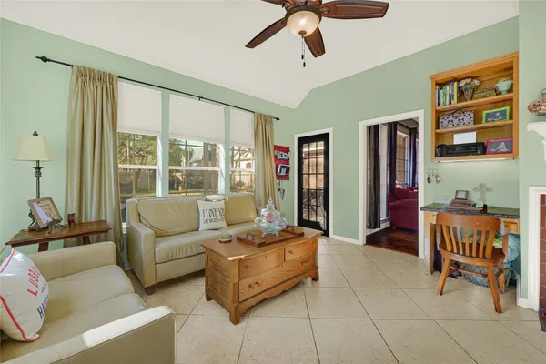 a bathroom with a tub a window and a shower