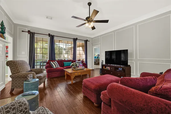 a living room with furniture or couch and a large window