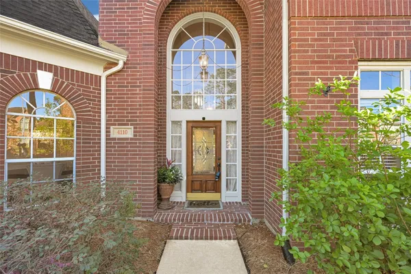 a kitchen with stainless steel appliances granite countertop a refrigerator a stove and a sink