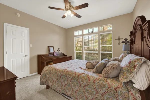a view of a livingroom and a dining room with furniture window and outside view