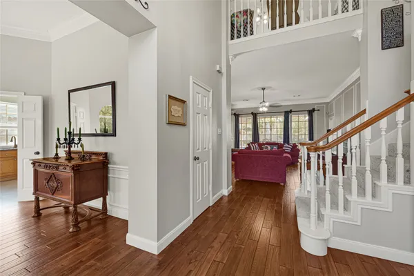 a view of a livingroom and a dining room with furniture window and outside view