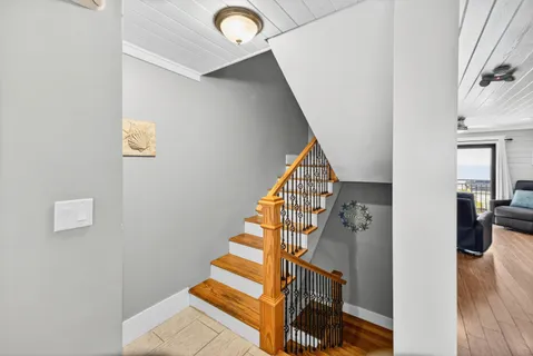 a view of entryway and hall with wooden floor