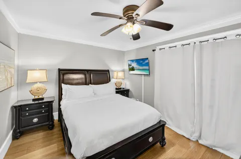 a bedroom with a bed and a tv