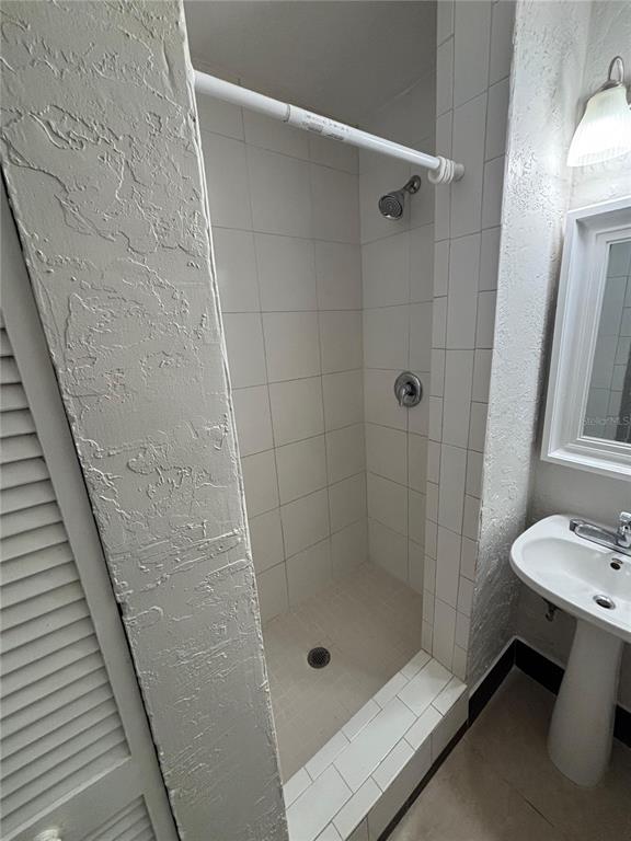 200 Magnolia Street Altamonte Springs, FL 32701 - Photo 4 of 6 a bathroom with a shower and sink