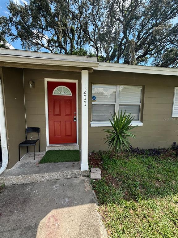 200 Magnolia Street Altamonte Springs, FL 32701 - Photo 5 of 6 a couple of potted plants in front of door