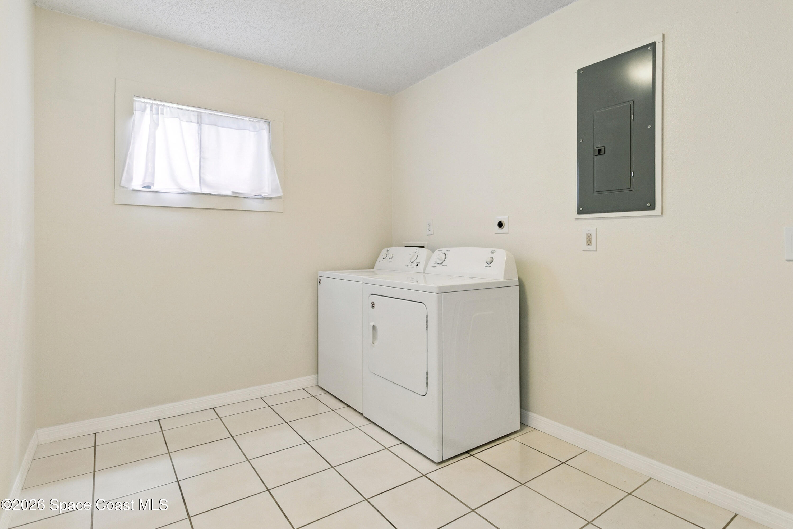 1334 Cherry Hills Road Northeast Palm Bay, FL 32905 - Photo 36 of 58 Large Laundry Room