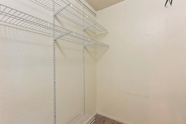 a view of a room with racks on the wall