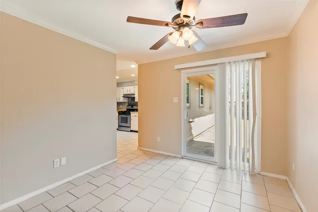 wooden floor in an empty room with a bathroom